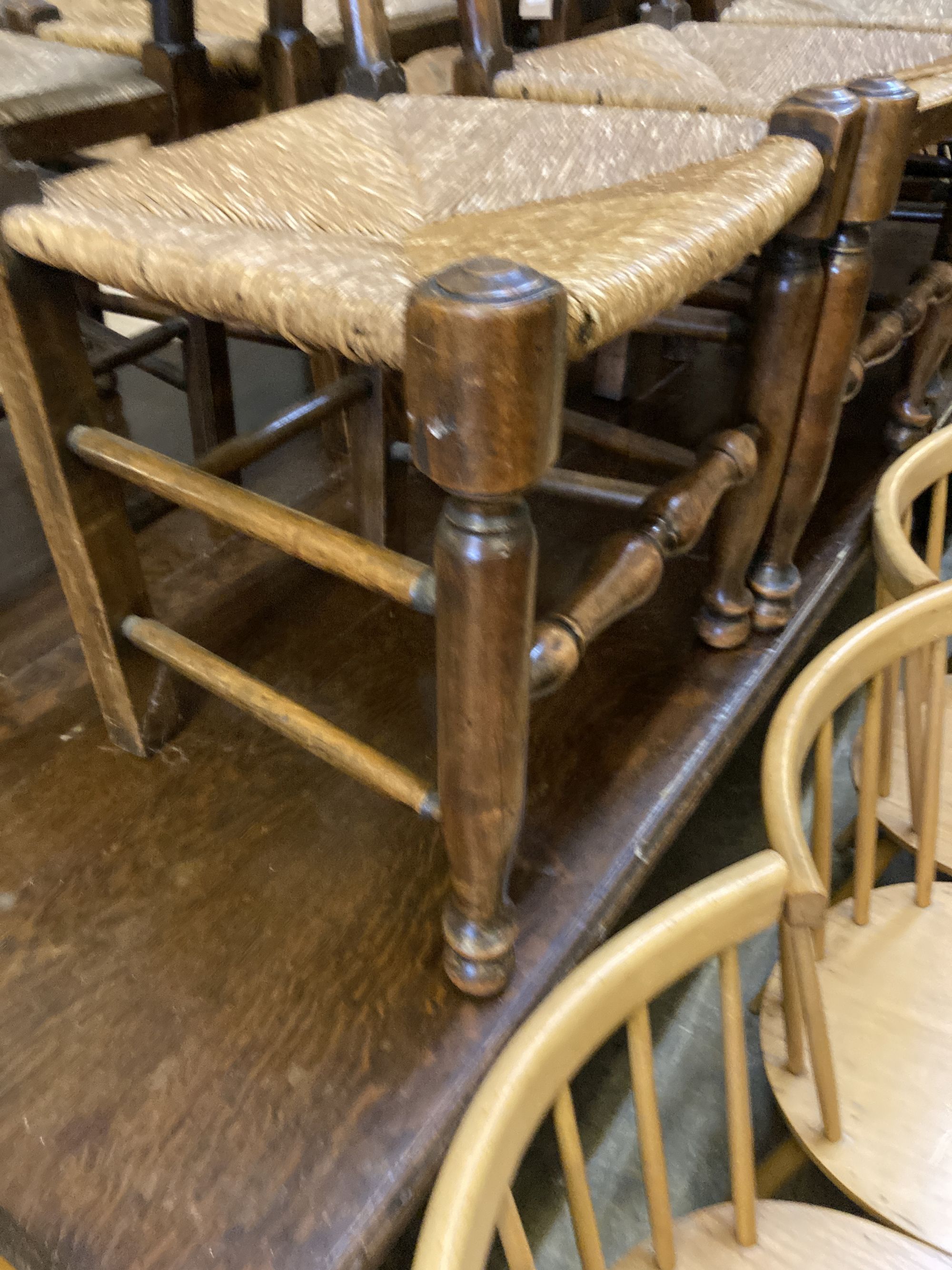 A harlequin set of nine early 19th century ash rush seated ladderback dining chairs (5 and 4)